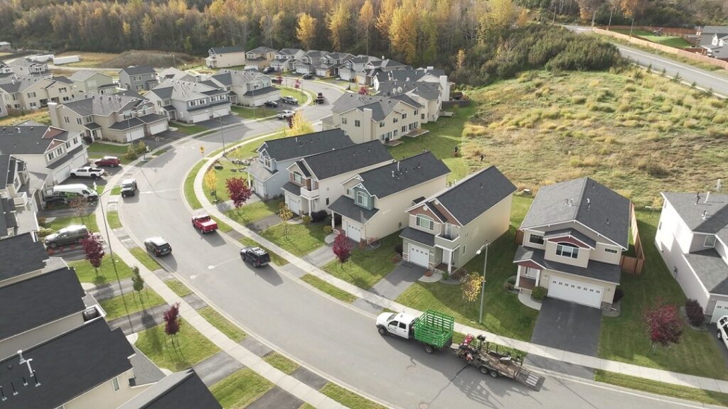 Aerial view of a large HOA neighborhood maintained by Alaska Premier Services during the summer in Anchorage