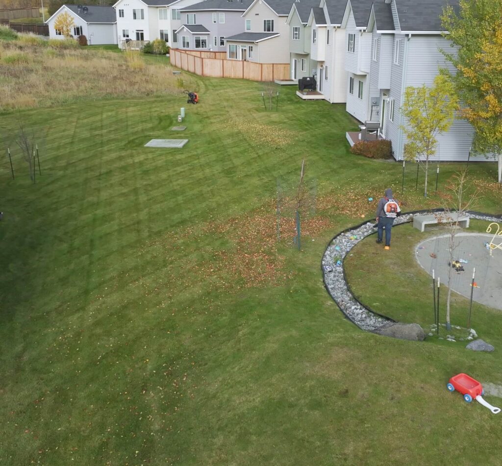 Professional lawn striping and grounds maintenance for a residential HOA townhouse community in Anchorage, Alaska.