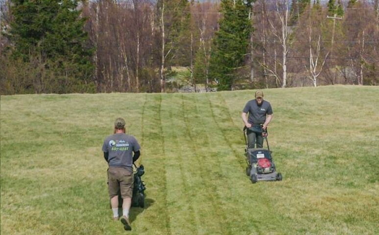 Alaska Premier Services crew performing weekly lawn mowing in Anchorage